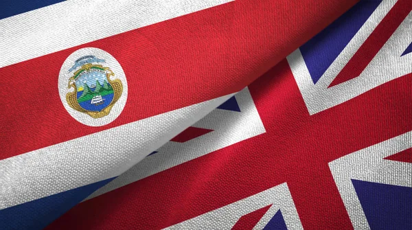 Costa Rica e Reino Unido duas bandeiras de pano têxtil, textura de tecido — Fotografia de Stock