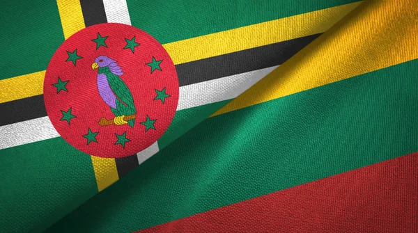 Dominica och Litauen två flaggor textil trasa, tyg konsistens — Stockfoto