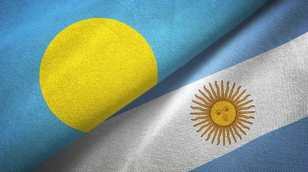 Palau és Argentína két zászló textil ruhával, szövet textúra — Stock Fotó