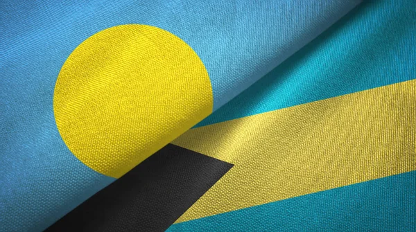 Palau és a Bahamák két zászló textil ruhával, szövet textúra — Stock Fotó