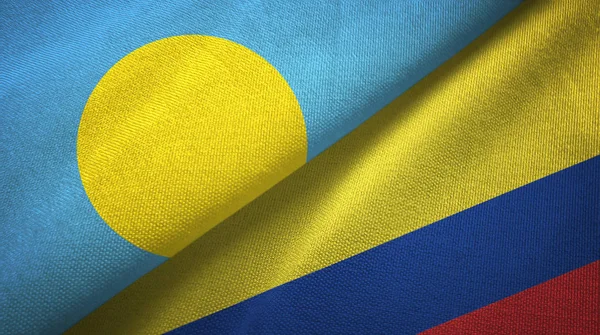 Palau et Colombie deux drapeaux tissu textile, texture du tissu — Photo
