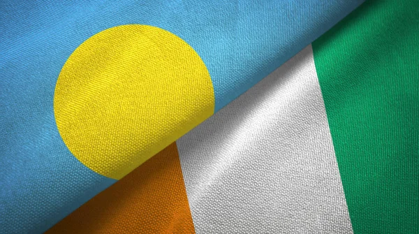 Palau and Cote dIvoire Ivory coast two flags textile fabric texture — Stock Photo, Image