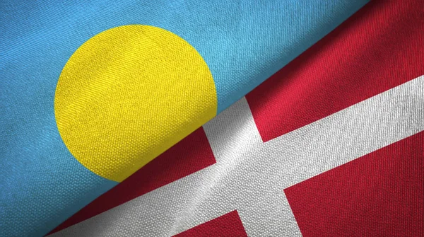Palau och Danmark två flaggor textil tyg, tyg konsistens — Stockfoto