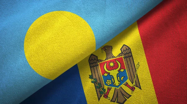 Palau y Moldavia dos banderas tela textil, textura de la tela —  Fotos de Stock