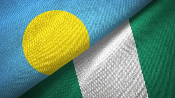 Palau e Nigéria duas bandeiras de pano têxtil, textura de tecido — Fotografia de Stock