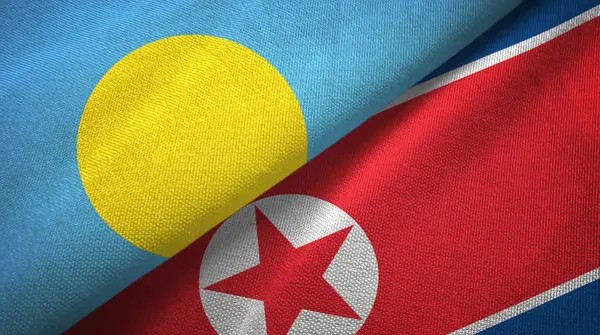 Palau and North Korea two flags textile cloth, fabric texture — Stock Photo, Image