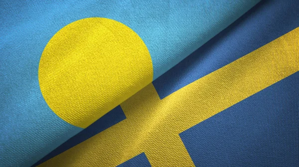 Палау і Швеція два прапори текстильна тканина, текстура тканини — стокове фото