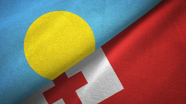 Palau a Tonga dvě vlajky textilní tkaniny, textura textilií — Stock fotografie