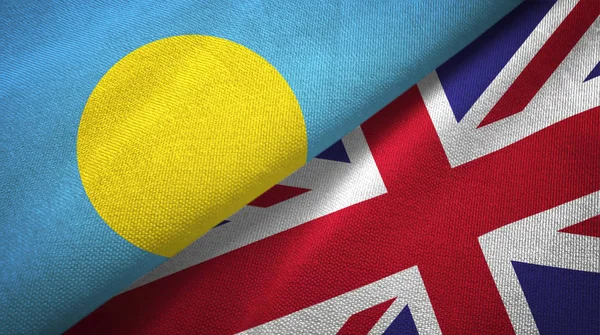 Palau y Reino Unido dos banderas tela textil, textura de la tela — Foto de Stock