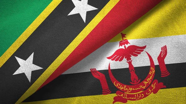 Saint Kitts e Nevis e Brunei due bandiere tessuto — Foto Stock