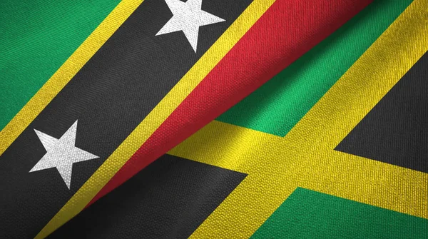 Saint Kitts és Nevis és Jamaica két zászló textil ruhával, szövet textúra — Stock Fotó