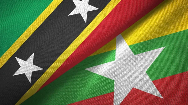 Saint Kitts e Nevis e Myanmar due bandiere tessuto, tessitura del tessuto — Foto Stock