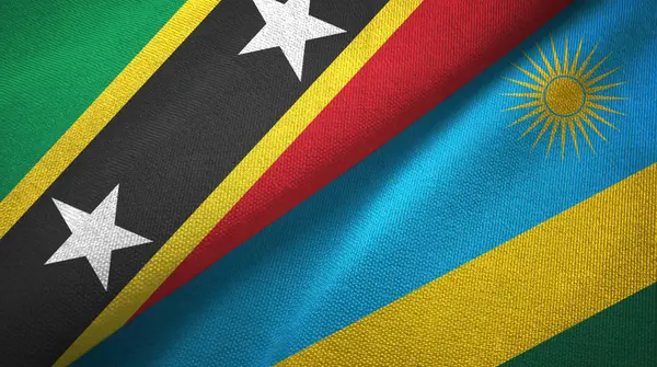 Saint Kitts en Nevis en Rwanda twee vlaggen textiel doek, stof textuur — Stockfoto