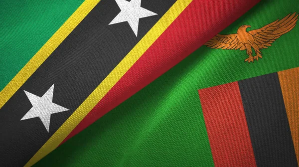 São Cristóvão e Nevis e Zâmbia duas bandeiras pano têxtil, textura de tecido — Fotografia de Stock