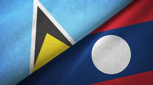 Santa Lúcia e Laos duas bandeiras tecido . — Fotografia de Stock