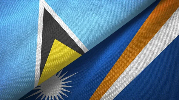 Saint Lucia en Marshall eilanden twee vlaggen textiel doek, stof textuur — Stockfoto