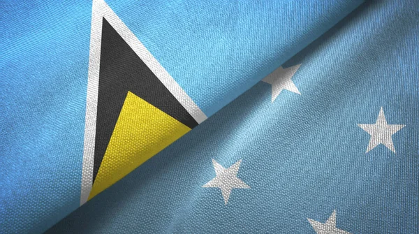 Saint Lucia and Micronesia two flags textile cloth, fabric texture — Stock Photo, Image