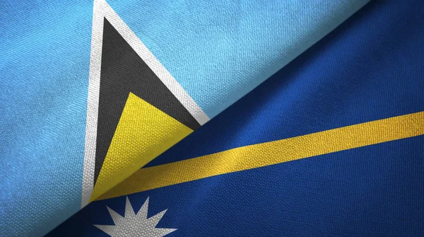 Santa Lúcia e Nauru duas bandeiras pano têxtil, textura de tecido — Fotografia de Stock