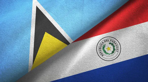 Saint Lucia and Paraguay two flags textile cloth, fabric texture — Stock Photo, Image