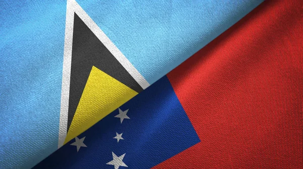 Saint Lucia and Samoa two flags textile cloth, fabric texture — Stock Photo, Image