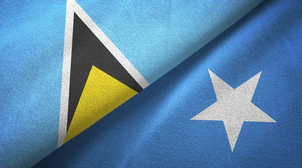 Η Αγία Λουκία και η Σομαλία δύο σημαίες ύφασμα υφασμάτων, υφή υφάσματος — Φωτογραφία Αρχείου
