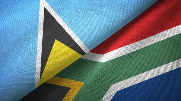 Santa Lúcia e África do Sul duas bandeiras pano têxtil, textura de tecido — Fotografia de Stock