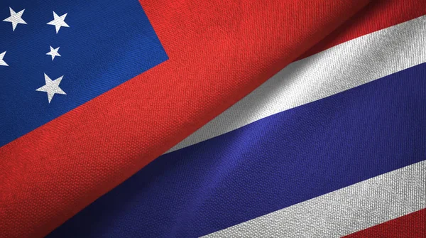 Samoa e Tailândia duas bandeiras de pano têxtil, textura de tecido — Fotografia de Stock