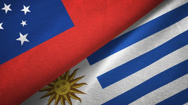 Samoa y Uruguay dos banderas de tela textil, textura de tela —  Fotos de Stock