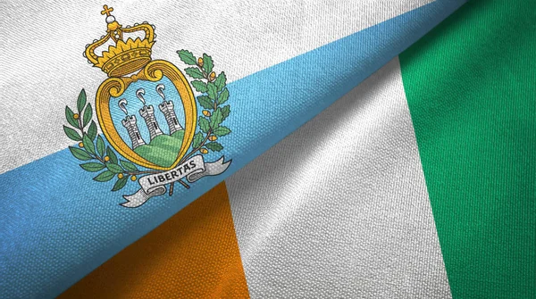 San Marino e Costa do Marfim Costa do Marfim duas bandeiras textura de tecido têxtil — Fotografia de Stock