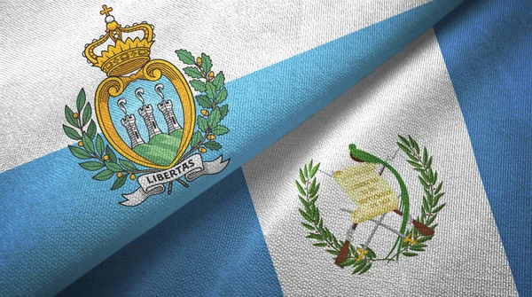 San Marino dan Guatemala dua bendera kain tekstil, tekstur kain — Stok Foto