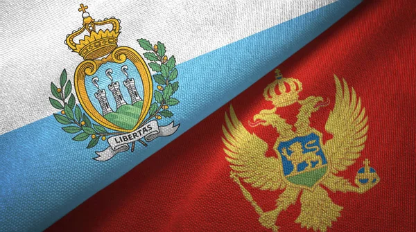 San Marino y Montenegro dos banderas tela textil, textura de la tela — Foto de Stock