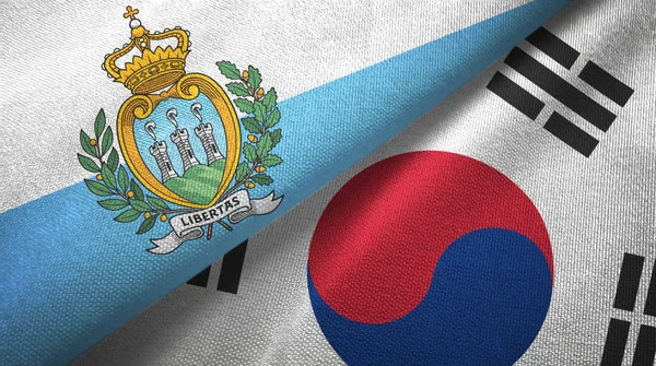 San Marino a Jižní Korea dvě vlajky textilní tkaniny, textura textilií — Stock fotografie