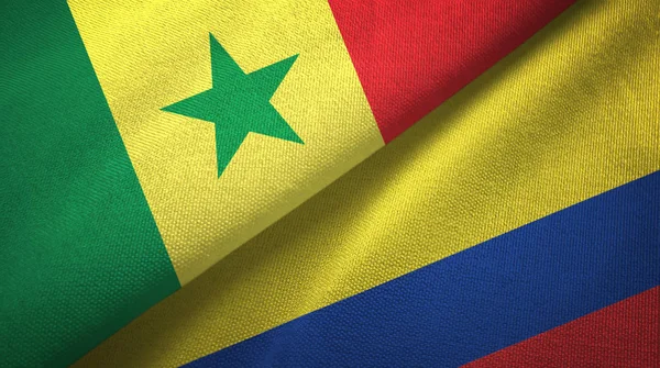 Senegal en Colombia twee vlaggen textiel doek, stof textuur — Stockfoto