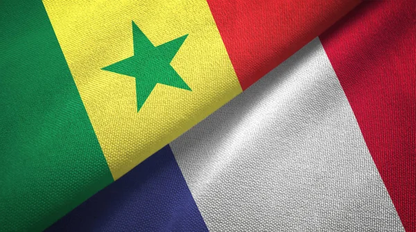 Senegal en Frankrijk twee vlaggen textiel doek, stof textuur — Stockfoto