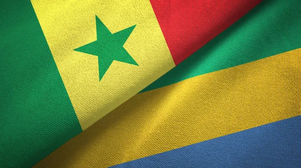 Senegal en Gabon twee vlaggen textiel doek, stof textuur — Stockfoto