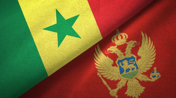 Senegal och Montenegro två flaggor textil trasa, tyg textur — Stockfoto