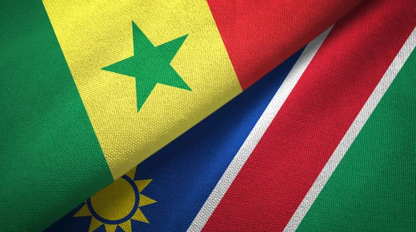 Senegal en Namibië twee vlaggen textiel doek, stof textuur — Stockfoto