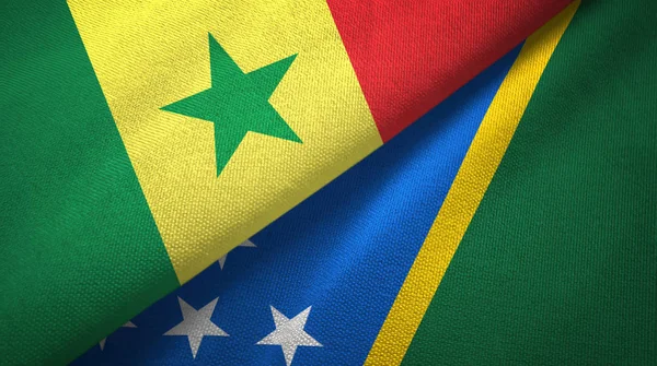 Senegal and Solomon Islands two flags textile cloth, fabric texture