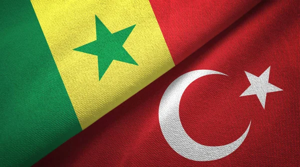 Senegal och Turkiet två flaggor textil tyg, tyg konsistens — Stockfoto