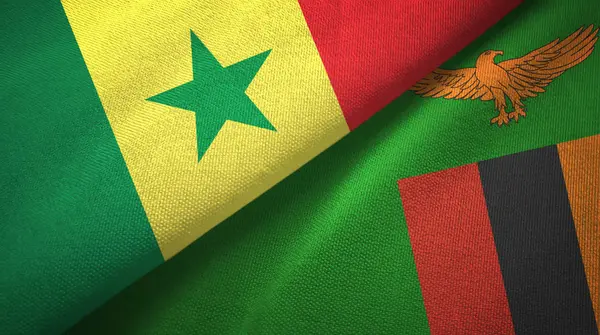 Senegal e Zambia due bandiere tessuto, tessitura tessuto — Foto Stock