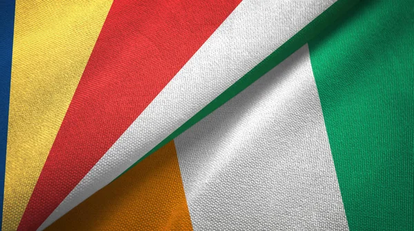 Seszele i Cote Czad Wybrzeża Kości Słoniowej dwie flagi tkaniny tekstylnej tekstury — Zdjęcie stockowe
