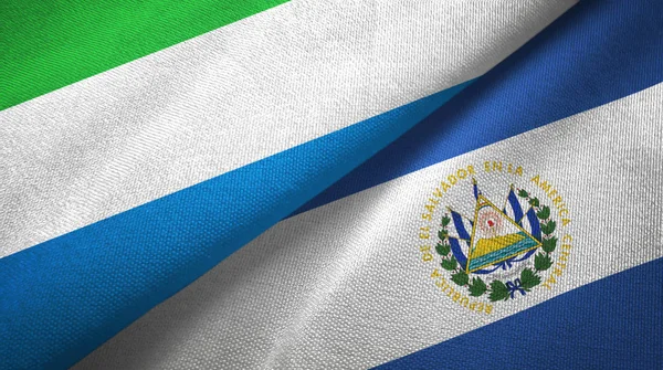 Sierra Leona y El Salvador dos banderas tela textil, textura de la tela —  Fotos de Stock