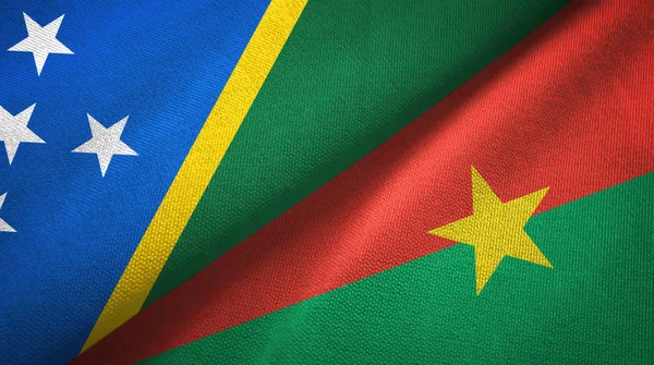 Solomon Island and Burkina Faso two flags textile cloth, fabric texture