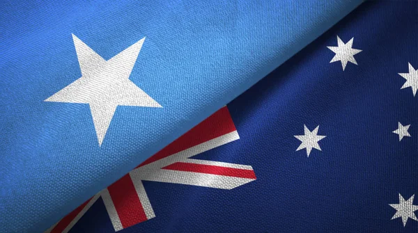 Somalia y Australia dos banderas tela textil, textura de la tela — Foto de Stock