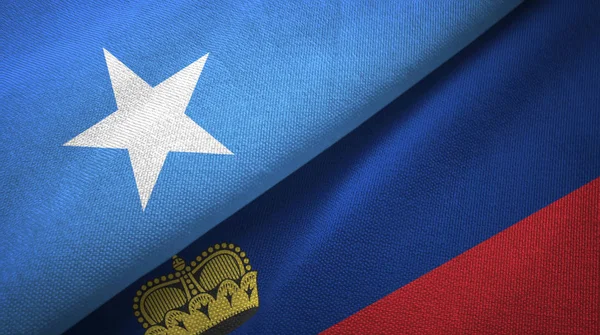 Somalia y Liechtenstein dos banderas tela textil, textura de la tela — Foto de Stock