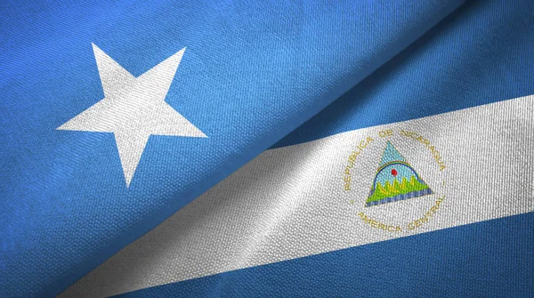 Somalia and Nicaragua two flags textile cloth, fabric texture — Stock Photo, Image