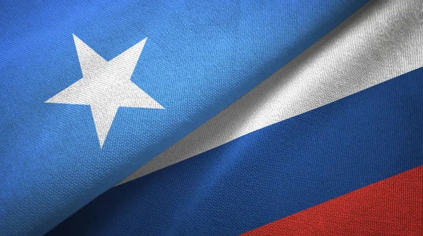 Somalië en Rusland twee vlaggen textiel doek, weefsel textuur — Stockfoto