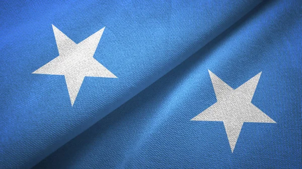 Somália duas bandeiras de pano têxtil, textura de tecido — Fotografia de Stock