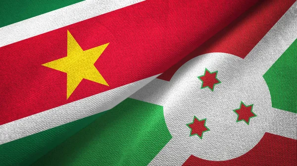 Suriname et Burundi deux drapeaux tissu textile, texture du tissu — Photo
