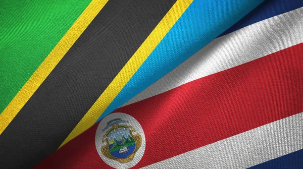 Tanzânia e Costa Rica duas bandeiras de pano têxtil, textura de tecido — Fotografia de Stock